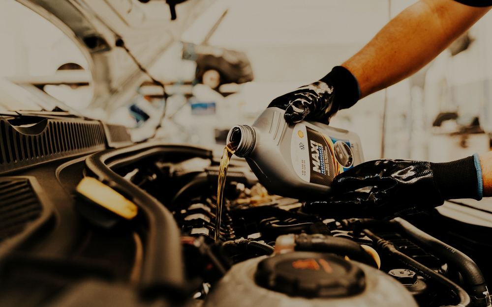 Fresh oil being poured into an engine